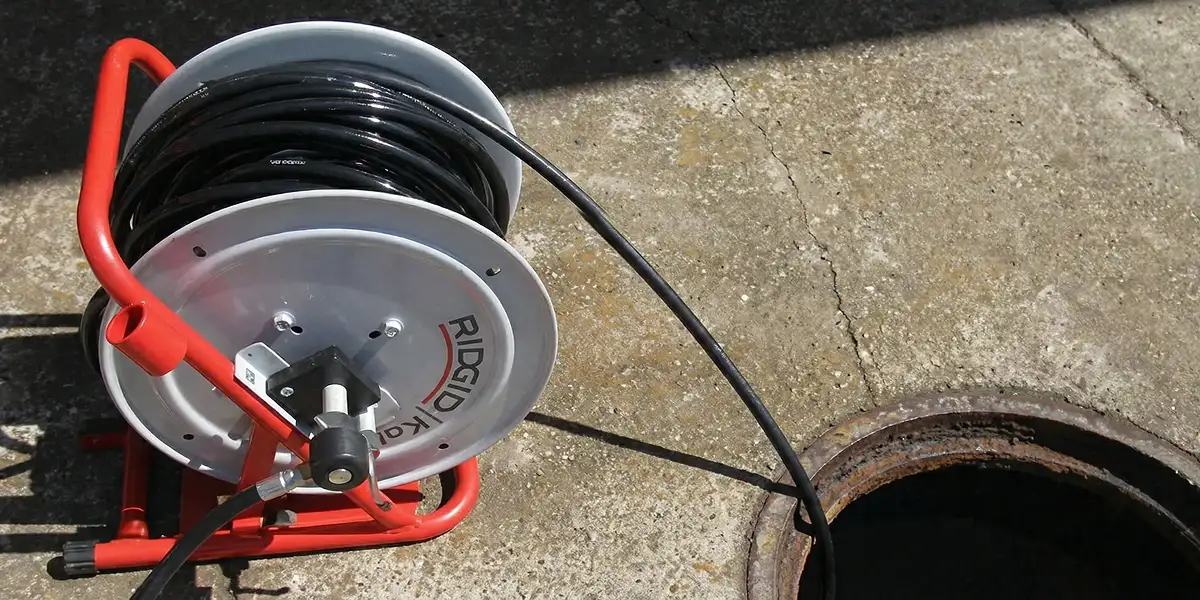 sewer rodding equipment prepared to clear clogged sewer lines in Richmond, VA
